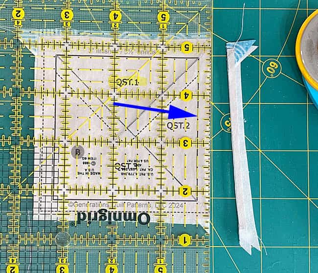 Trim the first side of a QST