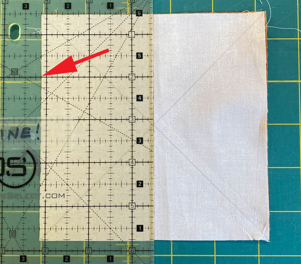 Cut the square in half through the vertical center