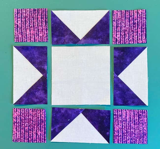 Arrange the patches in a Sawtooth Star design Arrange the patches in a Sawtooth Star design