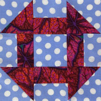Click here for the Churn Dash quilt block tutorial