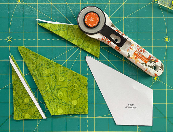 Using the template, the excess fabric is cut away from the Beam squares