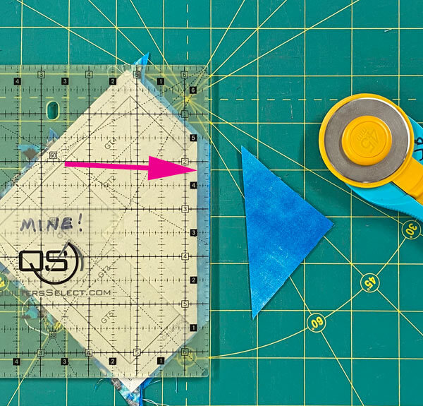 Trim away the excess fabric to leave a 1/4" seam allowance Trim away the excess fabric to leave a 1/4" seam allowance