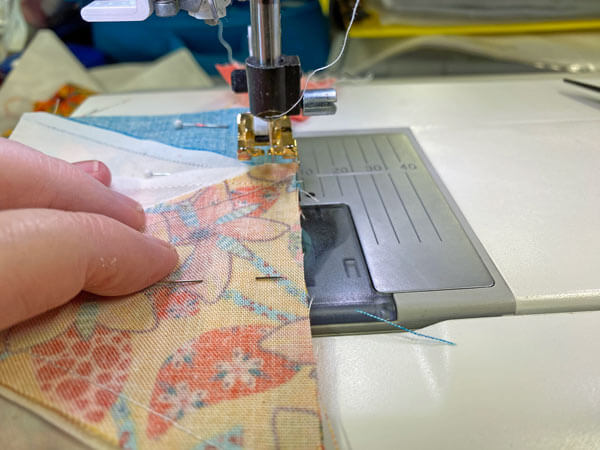 Sewing the pinned rows together Sewing the pinned rows together