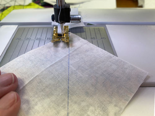 Sew 1/4" away from both sides of the drawn line Sew 1/4" away from both sides of the drawn line