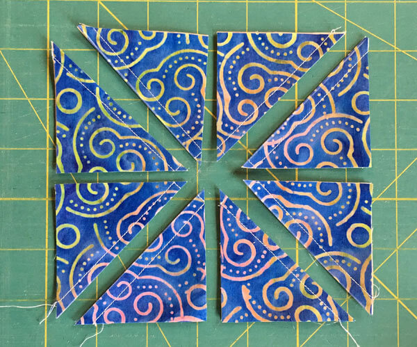 Eight HSTs ready for pressing and trimming Eight HSTs ready for pressing and trimming