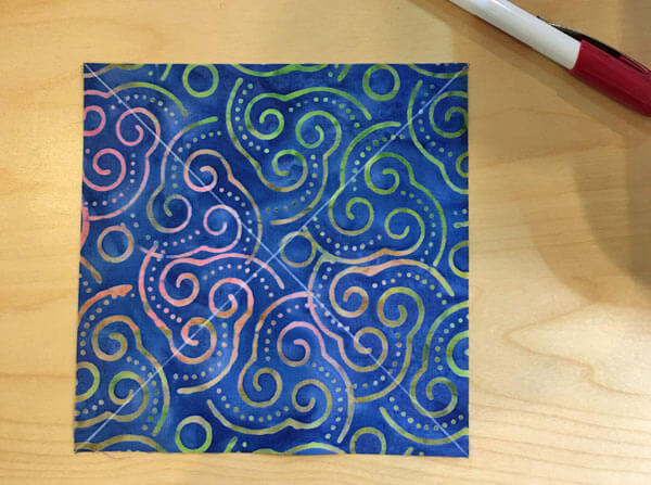 Mark the back of one large square with 2 diagonal lines Mark the back of one large square with 2 diagonal lines