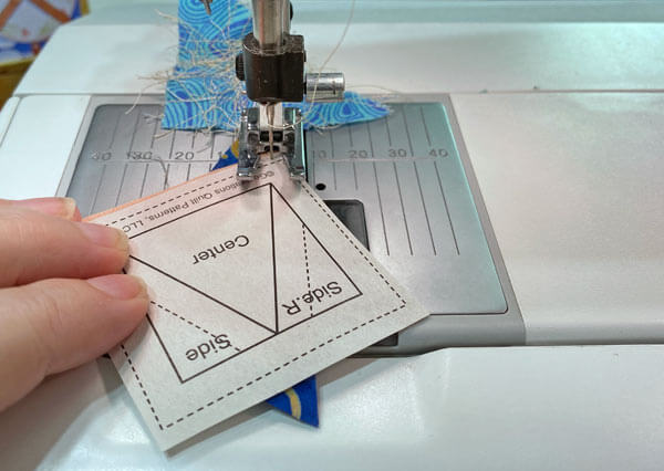 Start and end your stitches past the outside edges of the block Start and end your stitches past the outside edges of the block