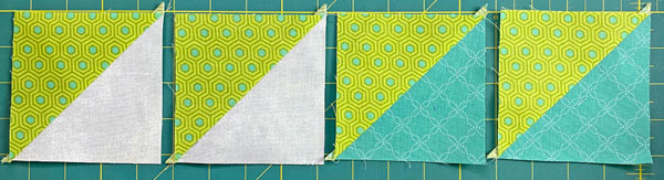 After cutting both pairs in half between the lines, we've got 4 HSTs to mark After cutting both pairs in half between the lines, we've got 4 HSTs to mark