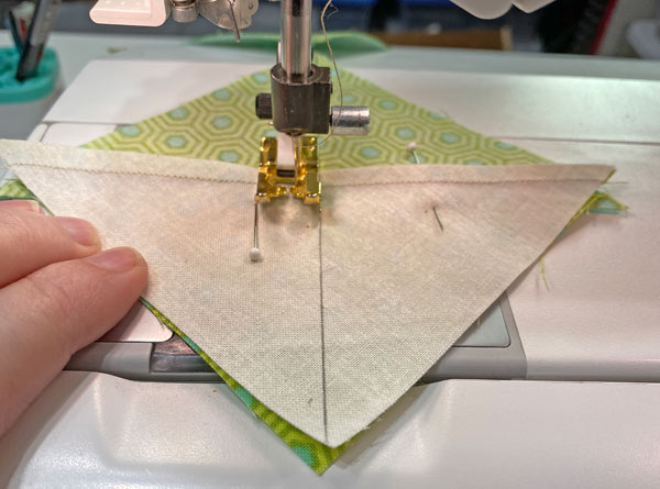 Sew 1/4" from both sides of the line Sew 1/4" from both sides of the line