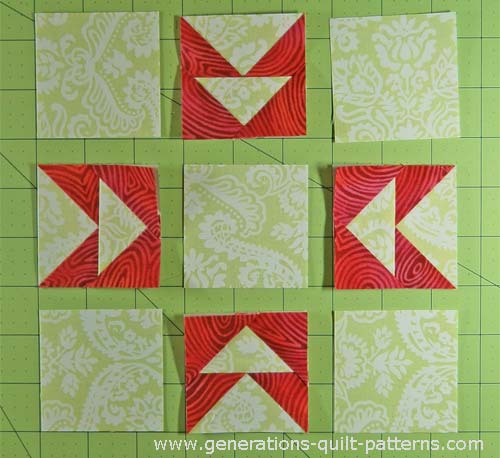 Lay out the solid squares and Flying Geese pairs in rows