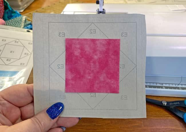 Center the first patch between the dashed placement lines Center the first patch between the dashed placement lines