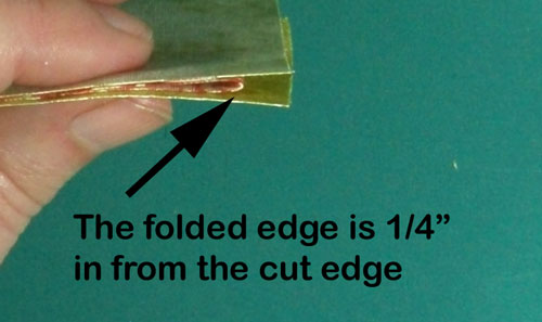 The folded edge is a quarter from the cut edge The folded edge is a quarter from the cut edge