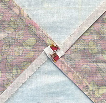 The seam in the center of the Quarter Square Triangle is twirled