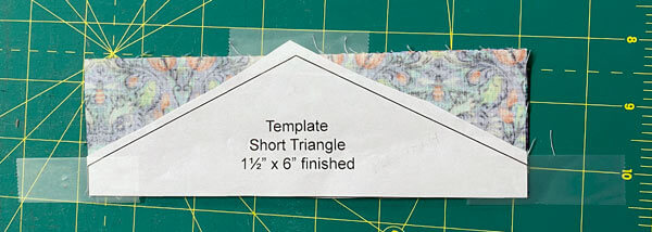 Align the edges of the Short Triangle Template with the edges of its rectangular patch
