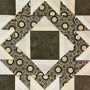 Click here to go to the instructions to make a Four Crowns quilt block