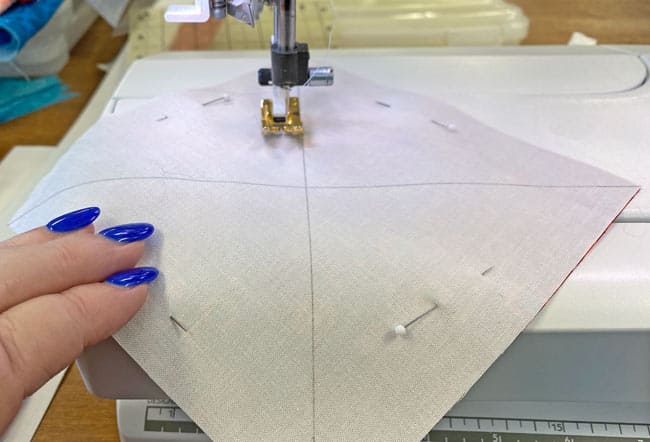 Stitch 1/4" away from both sides of both diagonal lines Stitch 1/4" away from both sides of both diagonal lines