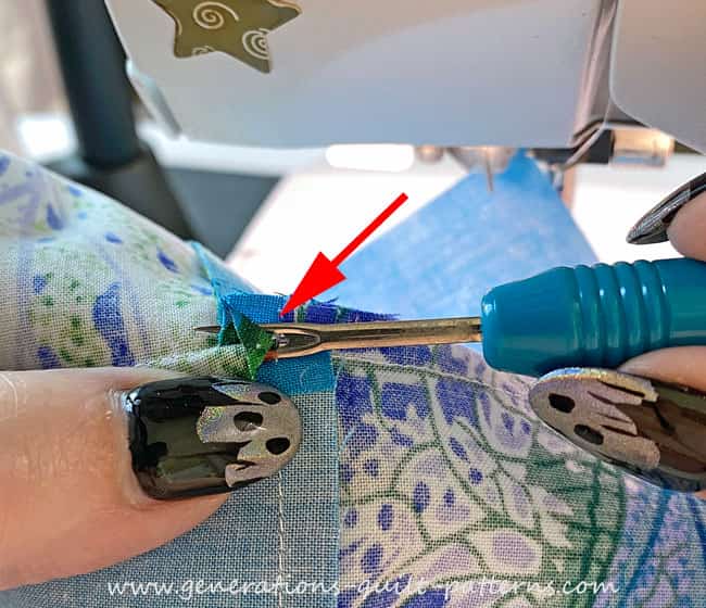 Using a seam ripper to open a seam allowance that's been glue basted