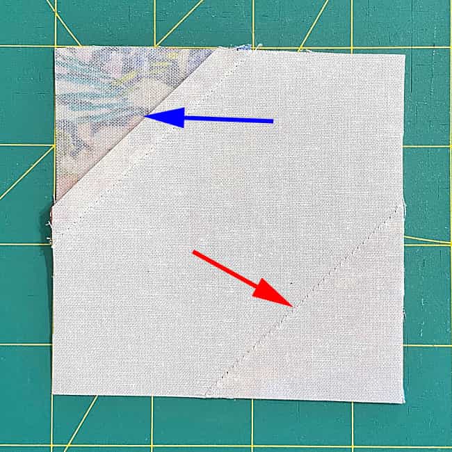 The upper left seam allowance (blue arrow) has been trimmed. The lower right has not...yet.