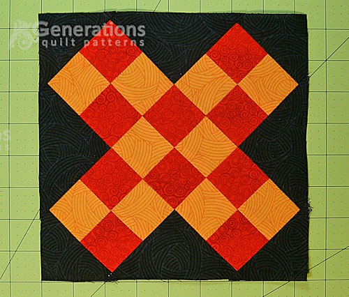 A finished Grandmother's Cross quilt block