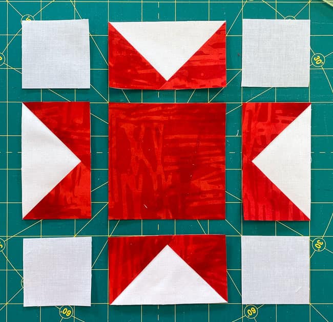 Arrange the patches into the Sawtooth Star design Arrange the patches into the Sawtooth Star design