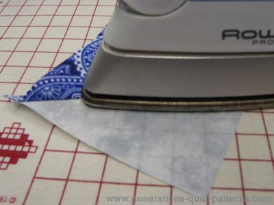 Press the patch open with the seam allowance towards the darker fabric Press the patch open with the seam allowance towards the darker fabric