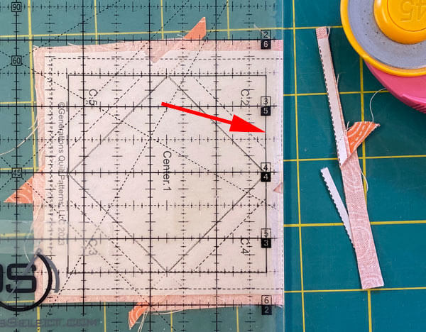 Trim away the excess on the first side Trim away the excess on the first side