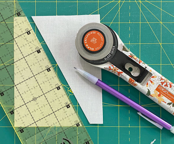 Line up your ruler with the marks at the edges and cut Line up your ruler with the marks at the edges and cut