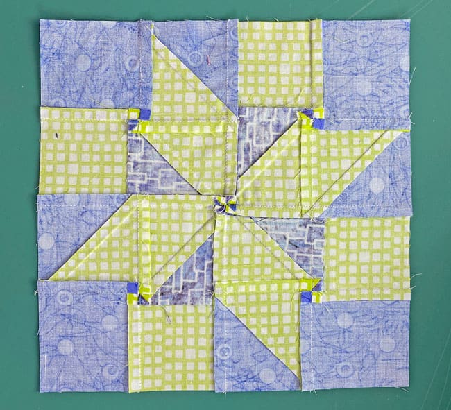 The backside of the finished Meteor quilt block with all its twirled or fanned seams The backside of the finished Meteor quilt block with all its twirled or fanned seams