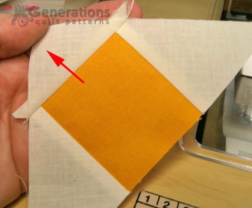 Press the corner triangle towards the outside edge