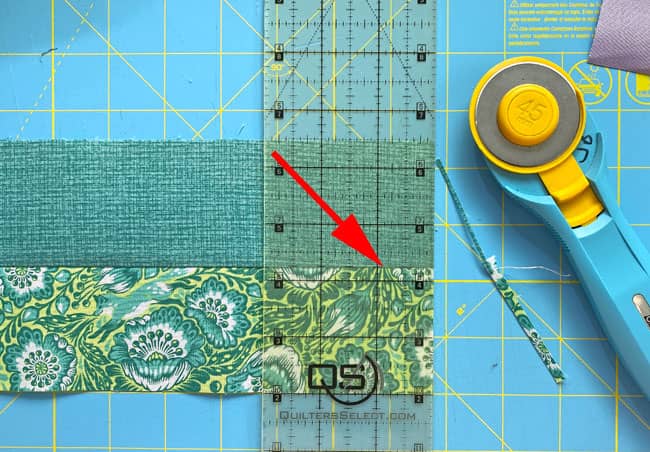 Straightening the short edge of a strip set Straightening the short edge of a strip set