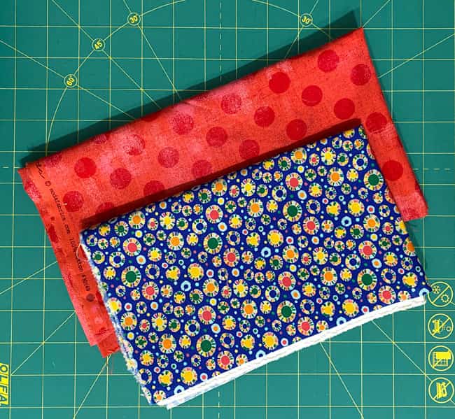 The blue print and red grunge fabrics used in the sample block