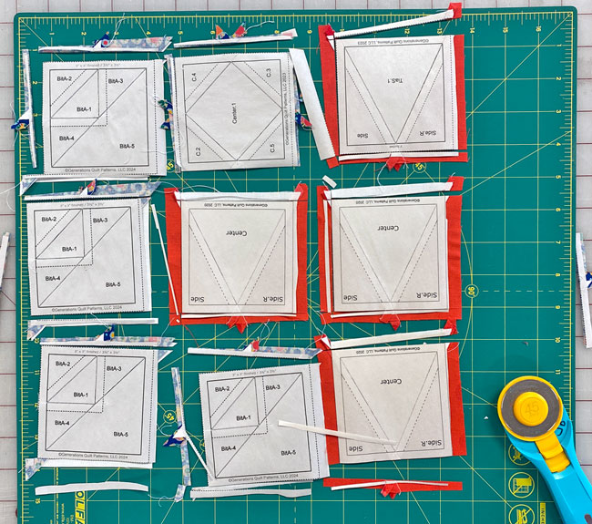 Mass trimming away the excess from the paper pieced units