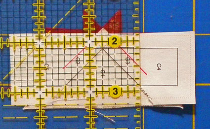 Position the edge of the ruler on the solid line