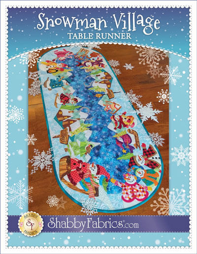 The Snowman Village Table Runner pattern is available from either Amazon or Annie's Catalog
