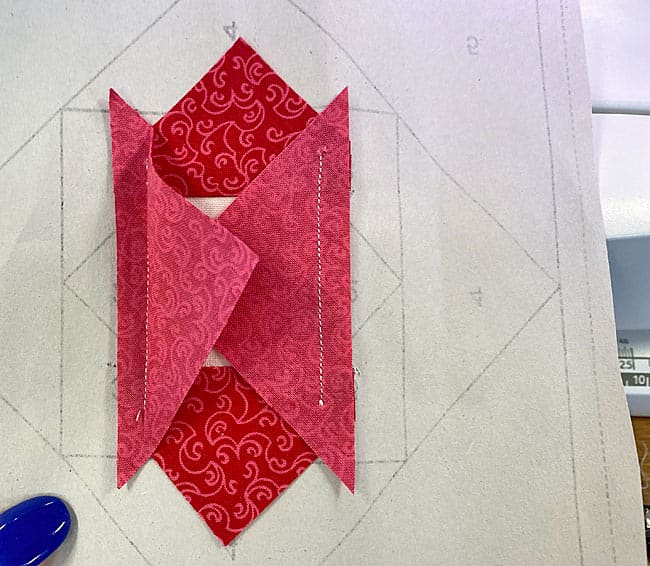 Trim away the dog ears before trimming to create the seam allowances Trim away the dog ears before trimming to create the seam allowances