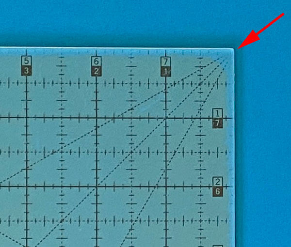 Quilters Select ruler with the grippy stuff wearing off the back side.