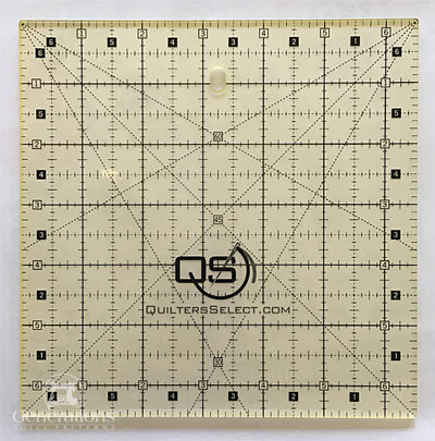 The Quilters Select 6-1/2" square ruler. Available from Annie's.
