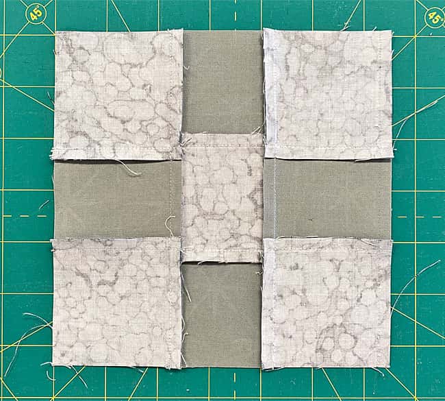 9-patch backside showing the pressing of the seam allowances 9-patch backside showing the pressing of the seam allowances