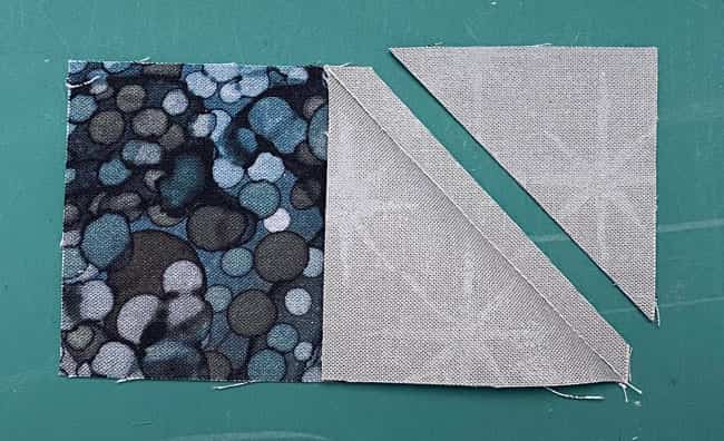 Trim the excess away leaving behind our standard 1/4" seam allowance Trim the excess away leaving behind our standard 1/4" seam allowance