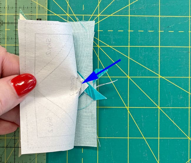 Pull the paper away from the stitches holding the Sky.1s