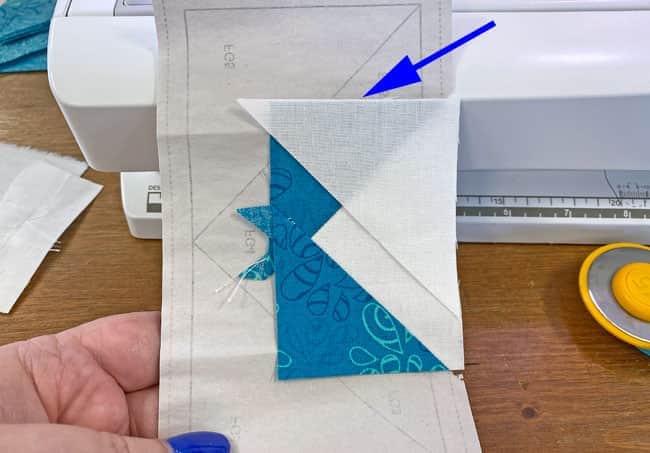 Position an FG3 and nudge it a couple of threads over to prevent the shadowing of the darker fabric later on