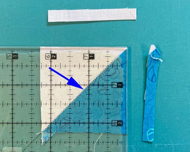Trim away the excess on the first two sides of a HST