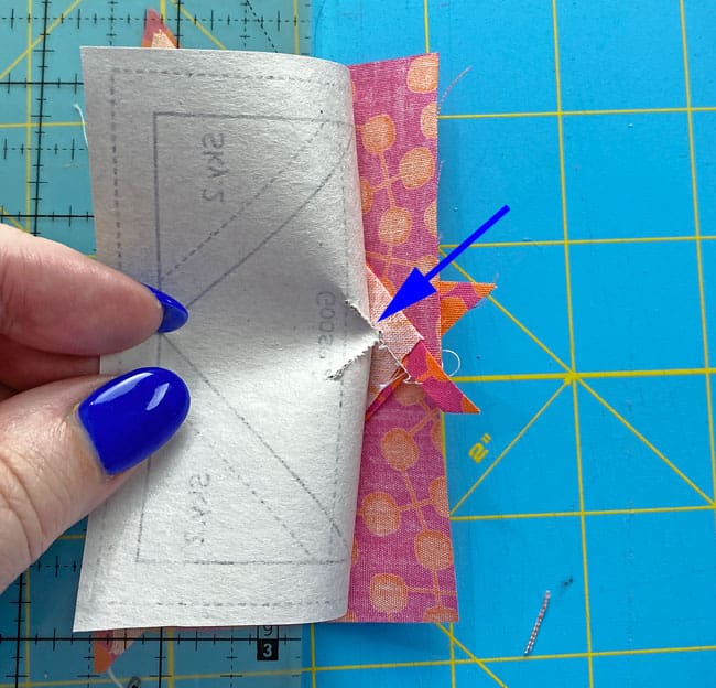 Pull the pattern away from the stitches in the center Pull the pattern away from the stitches in the center