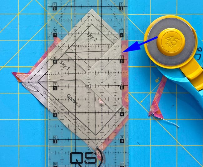 Trim away the excess fabric from each side of the Goose2 Trim away the excess fabric from each side of the Goose2