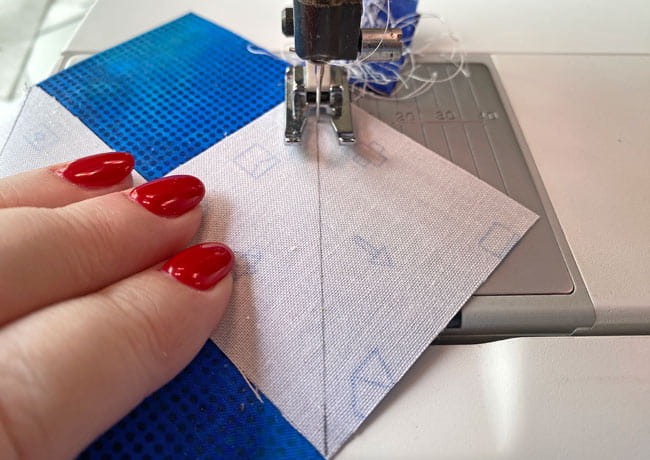 Stitching one the side of the line closest to the corner.