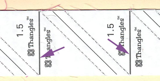 Pointing out the thin white line on the cutting lines