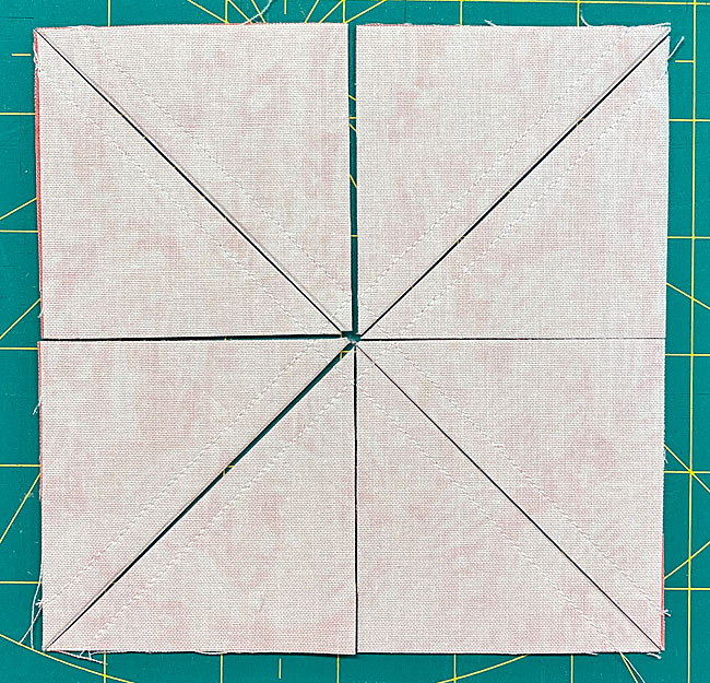 Cut each square in half on the drawn line