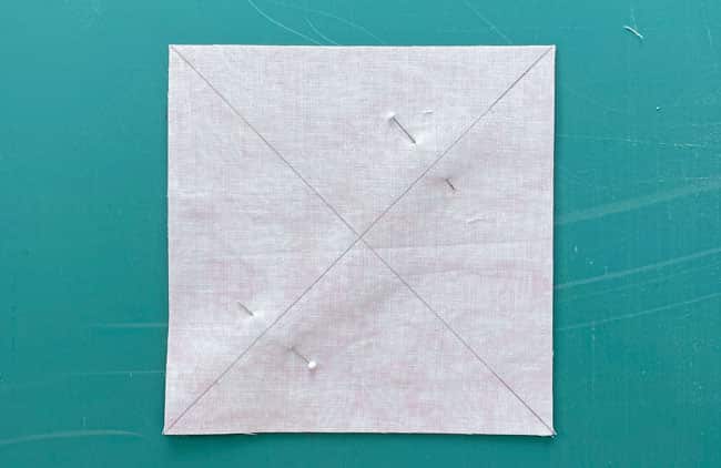 Draw two diagonal lines from corner to corner on the back side of #2