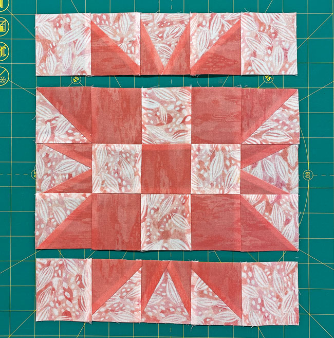 Stitch a border unit to the left and right sides of the 9-patch