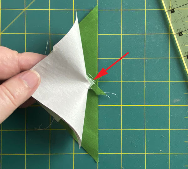 Tear the pattern away from the stitches at the center Tear the pattern away from the stitches at the center